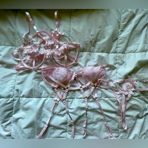 Light pink lingerie set with garter belt and leg loops